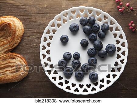 Stock Photo - Plate of blueberries with pastry. Fotosearch