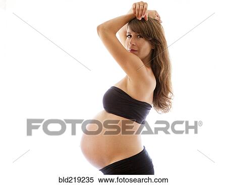 Stock Photography - Profile of pregnant Caucasian woman. Fotosearch