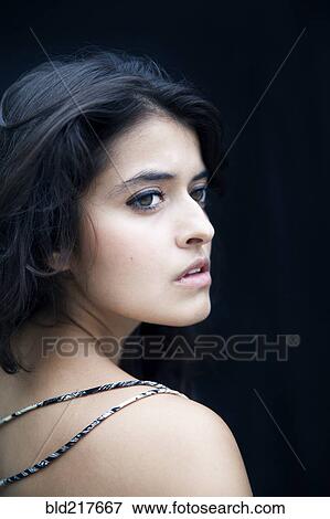 Stock Photo - Profile of serious mixed race woman. Fotosearch