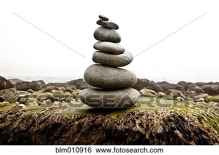 Stock Photograph - Pyramid of stacked rocks. Fotosearch