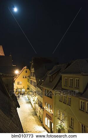 Quaint, snow covered village at night View Large Photo Image Stock Image - Quaint, snow covered village at night. Fotosearch
