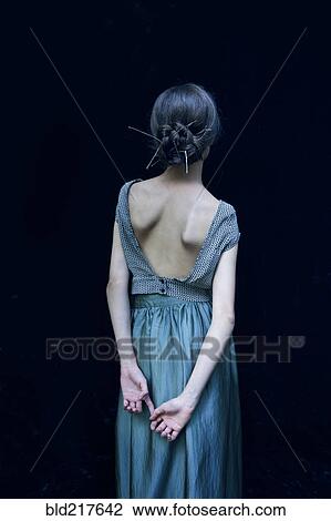 Rear view of woman wearing evening gown View Large Photo Image Stock Image - Rear view of woman wearing evening gown. Fotosearch