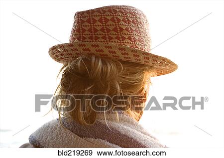 Rear view of woman wearing straw hat View Large Photo Image Stock Photo - Rear view of woman wearing straw hat. Fotosearch