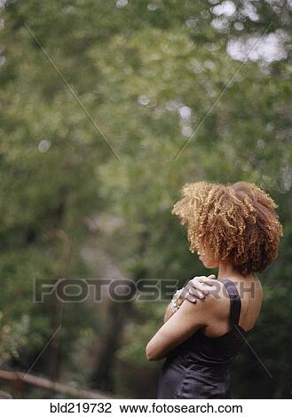 Rear view woman admiring forest view View Large Photo Image Stock Image - Rear view woman admiring forest view. Fotosearch