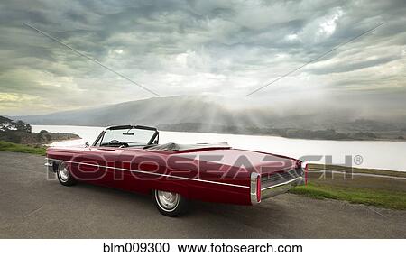 Red convertible parked on side of road View Large Photo Image Stock Image - Red convertible parked on side of road. Fotosearch