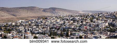 Rolling hills and rooftops of city View Large Photo Image Stock Image - Rolling hills and rooftops of city. Fotosearch
