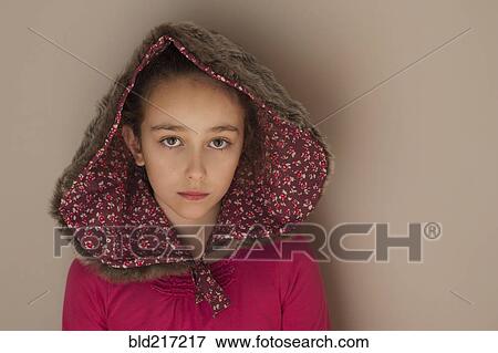 Stock Photo - Sad Caucasian girl wearing hood. Fotosearch