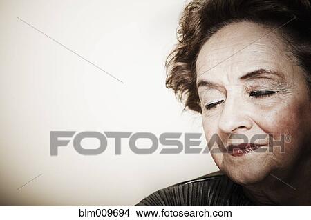 Senior woman with eyes closed View Large Photo Image Picture - Senior woman with eyes closed. Fotosearch