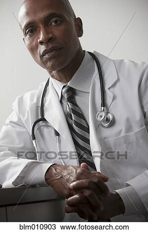 Serious African American doctor View Large Photo Image Stock Image - Serious African American doctor. Fotosearch