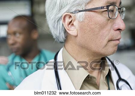 Serious Asian doctor View Large Photo Image Stock Image - Serious Asian doctor. Fotosearch