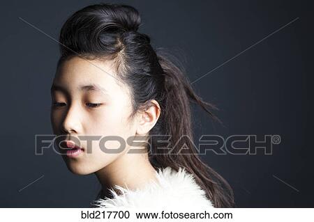 Serious Asian girl wearing fur shawl View Large Photo Image Stock Image - Serious Asian girl wearing fur shawl. Fotosearch