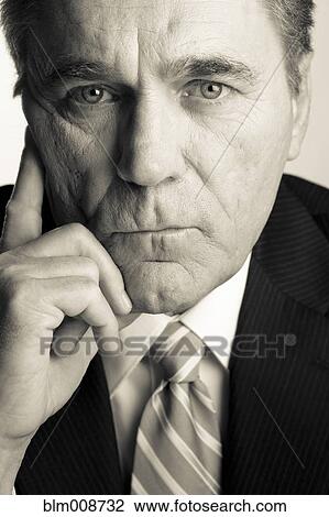 Serious Caucasian businessman with head in hands View Large Photo Image Stock Image - Serious Caucasian businessman with head in hands. Fotosearch