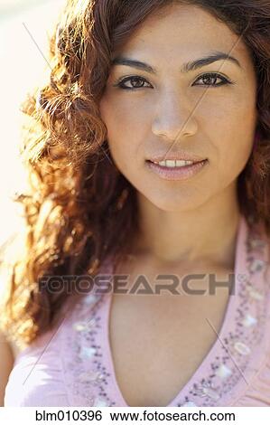 Stock Photograph - Serious Hispanic woman. Fotosearch