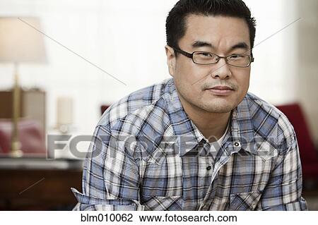 Stock Image - Serious Korean man. Fotosearch