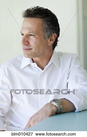Stock Photo - Serious man thinking. Fotosearch