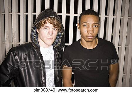 Stock Photo - Serious men standing together. Fotosearch