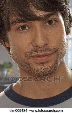 Picture - Serious mixed race man. Fotosearch
