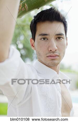 Stock Photo - Serious mixed race man. Fotosearch