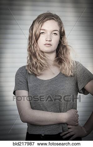 Serious woman standing with hand on hip View Large Photo Image Stock Photo - Serious woman standing with hand on hip. Fotosearch