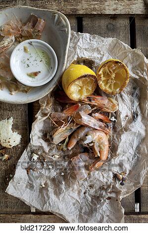 Shrimp with lemon and dipping sauce View Large Photo Image Stock Photo - Shrimp with lemon and dipping sauce. Fotosearch