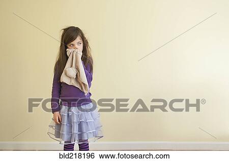 Sick Caucasian girl wiping nose View Large Photo Image Stock Photograph - Sick Caucasian girl wiping nose. Fotosearch