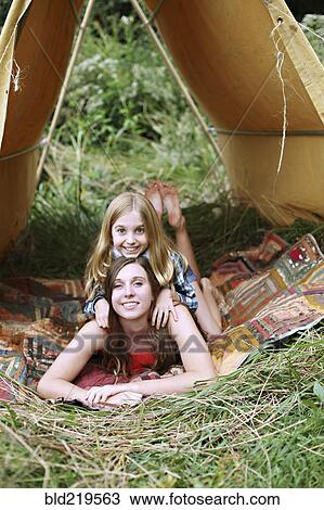 Sisters laying in camping tent View Large Photo Image Stock Image - Sisters laying in camping tent. Fotosearch
