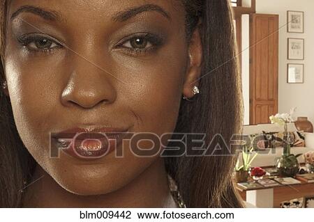 Smiling African American woman in living room View Large Photo Image Stock Image - Smiling African American woman in living room. Fotosearch