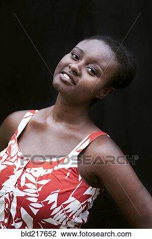 Smiling Black woman wearing sun dress View Large Photo Image Stock Image - Smiling Black woman wearing sun dress. Fotosearch