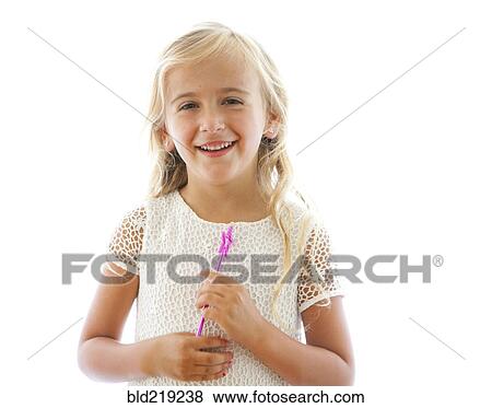 Smiling Caucasian girl holding fairy wand View Large Photo Image Stock Photo - Smiling Caucasian girl holding fairy wand. Fotosearch