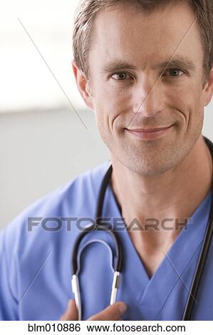 Stock Photograph - Smiling Caucasian surgeon. Fotosearch