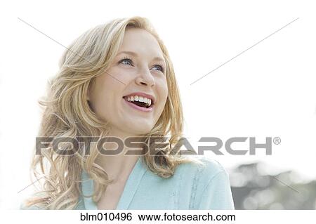 Smiling Caucasian woman outdoors View Large Photo Image Stock Photograph - Smiling Caucasian woman outdoors. Fotosearch