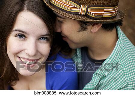 Stock Photography - Smiling couple hugging. Fotosearch