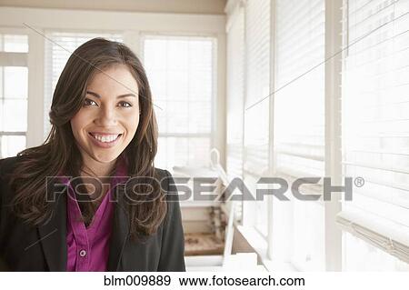 Stock Photo - Smiling Hispanic businesswoman. Fotosearch