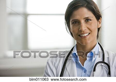 Stock Image - Smiling Hispanic doctor. Fotosearch