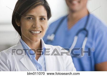 Stock Image - Smiling hispanic doctor. Fotosearch
