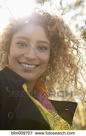 Smiling Hispanic woman outdoors View Large Photo Image Stock Photo - Smiling Hispanic woman outdoors. Fotosearch