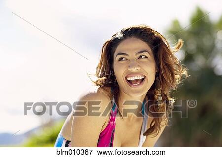 Stock Photo - Smiling Hispanic woman. Fotosearch