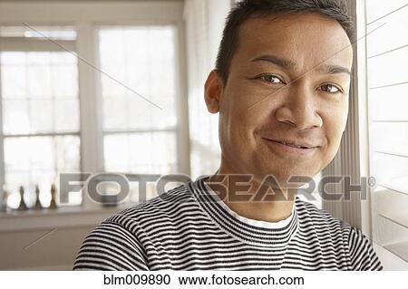 Stock Image - Smiling Malaysian man. Fotosearch
