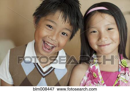 Smiling mixed race brother and sister View Large Photo Image Stock Photo - Smiling mixed race brother and sister. Fotosearch