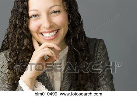 Stock Photo - Smiling mixed race businesswoman. Fotosearch