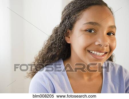 Stock Photography - Smiling mixed race girl. Fotosearch