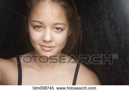 Stock Photography - Smiling mixed race girl. Fotosearch