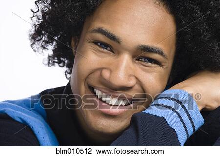Stock Image - Smiling mixed race man. Fotosearch