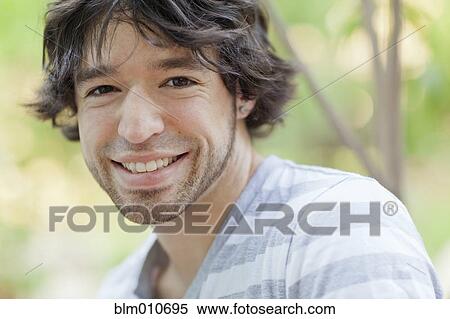 Stock Photography - Smiling mixed race man. Fotosearch