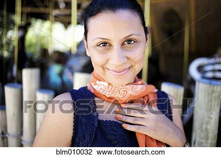 Smiling mixed race woman in scarf View Large Photo Image Stock Image - Smiling mixed race woman in scarf. Fotosearch