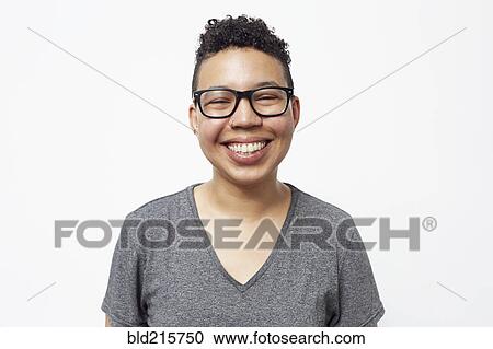 Stock Image - Smiling mixed race woman wearing eyeglasses. Fotosearch