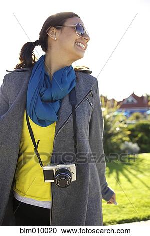 Smiling mixed race woman with old-fashioned camera View Large Photo Image Stock Image - Smiling mixed race woman with old-fashioned camera. Fotosearch