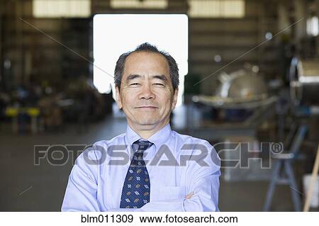 Stock Photo - Smiling Pacific Islander businessman. Fotosearch