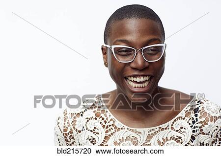 Stock Image - Smiling stylish woman wearing eyeglasses. Fotosearch