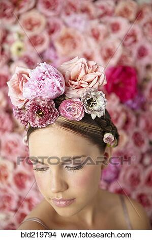 Smiling woman wearing flowers in her hair View Large Photo Image Picture - Smiling woman wearing flowers in her hair. Fotosearch